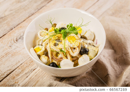 Salad with calamari, mozzarella cheese, olives 66567289