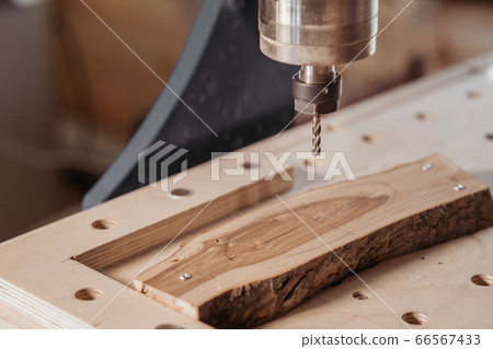 Machine tool in wood factory with drilling cnc machines. Computer numerical control Machine tool in wood factory with drilling cnc machines. Computer numerical control 66567433