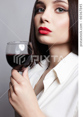 Girl with glass of wine. Beautiful woman drinking Girl with glass of wine. Beautiful woman drinking 66567845