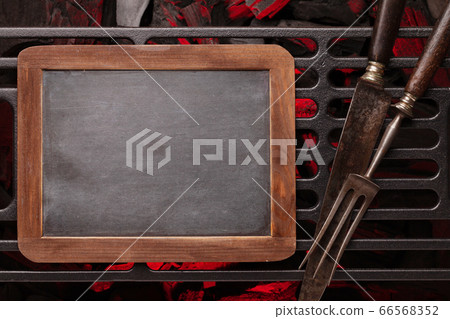 Chalkboard over barbecue grill Chalkboard over barbecue grill 66568352