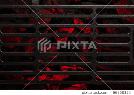 Metal barbecue grill over hot coal Metal barbecue grill over hot coal 66568353