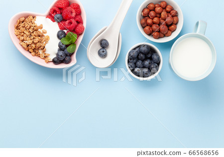 Healthy breakfast with granola, yogurt and berries Healthy breakfast with granola, yogurt and berries 66568656