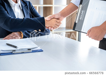 Greeting new colleagues, Handshake while job Greeting new colleagues, Handshake while job 66568778
