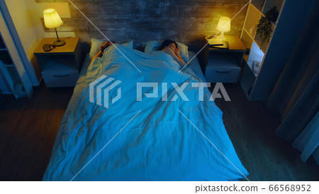 Top view of young couple sleeping Top view of young couple sleeping 66568952