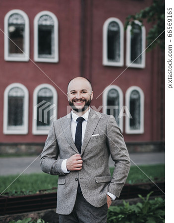 Positive handsome businessman 66569165
