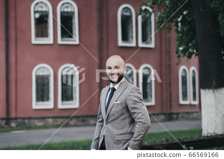 Young handsome man in suit 66569166