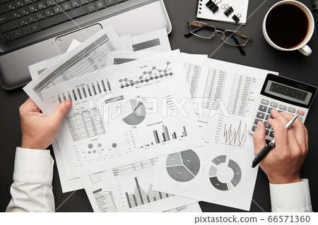 Top view of businessman's hands working with Top view of businessman's hands working with 66571360