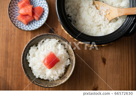 Place the cod on top of freshly cooked rice Place the cod on top of freshly cooked rice 66572630