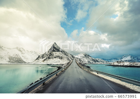 Olstind Mount and asphalt road. Lofoten islands, 66573991