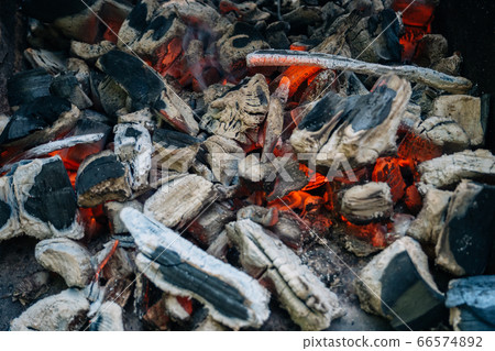 hot red coals in the fire after the combustion of wooden boards hot red coals in the fire after the combustion of wooden boards 66574892