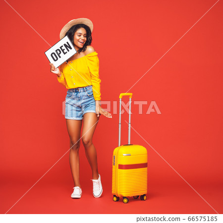concept of travel. Optimist ethnic lady with concept of travel. Optimist ethnic lady with 66575185