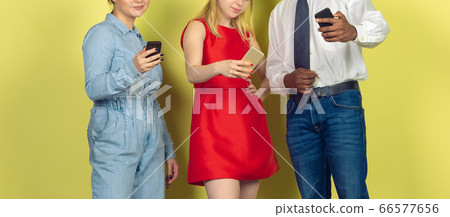 Group of friends using mobile smartphones. Teenagers addiction to new technology trends. Close up. 66577656