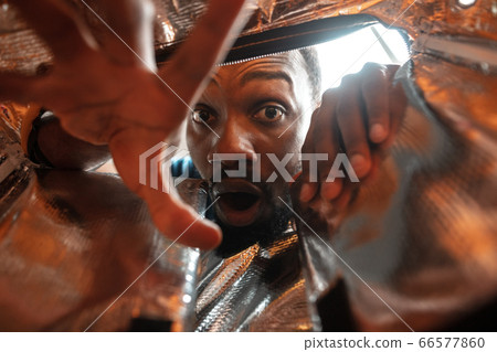 African-american man looking for job in unusual places at his home African-american man looking for job in unusual places at his home 66577860