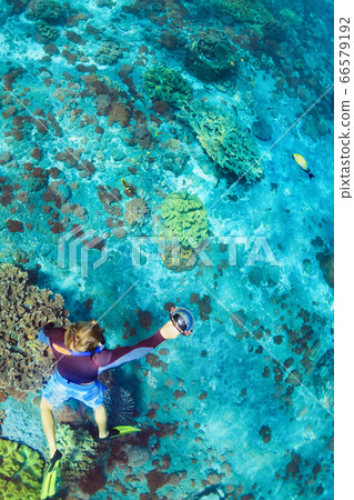 Young man in snorkelling mask dive underwater 66579192