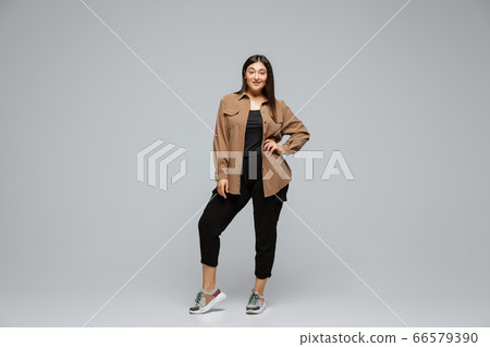 Young caucasian woman in casual wear. Bodypositive female character, plus size businesswoman Young caucasian woman in casual wear. Bodypositive female character, plus size businesswoman 66579390