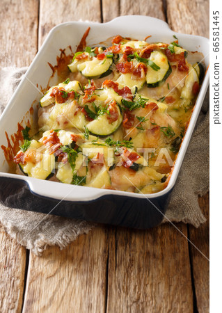 Baked chicken breast with zucchini, bacon and 66581445