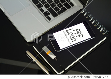 Office table with laptop, phone and supplies 66581763