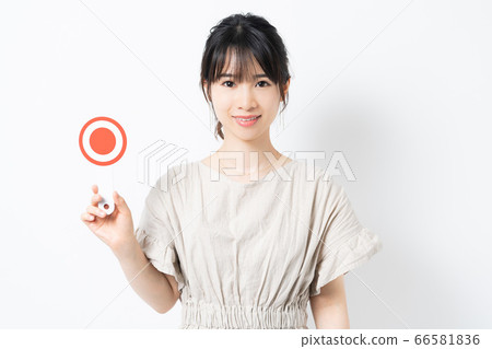 Young woman with mal placard Young woman with mal placard 66581836