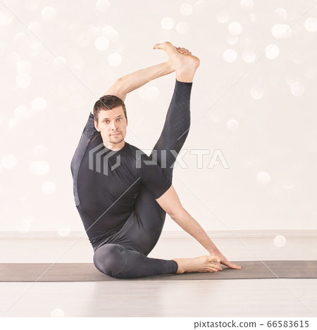 Man in yoga asana. Home studio. One person 66583615