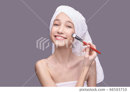 Girl with cosmetic brush. Beauty woman portrait. Peeling concept Girl with cosmetic brush. Beauty woman portrait. Peeling concept 66583710