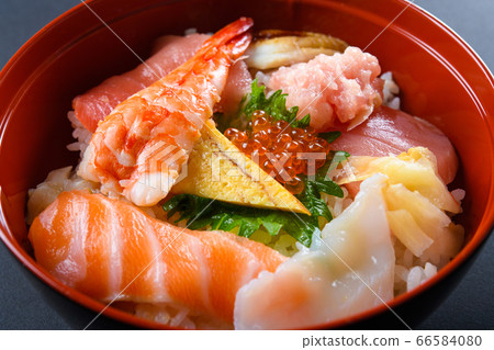 Bowl of rice topped with sashimi Bowl of rice topped with sashimi 66584080