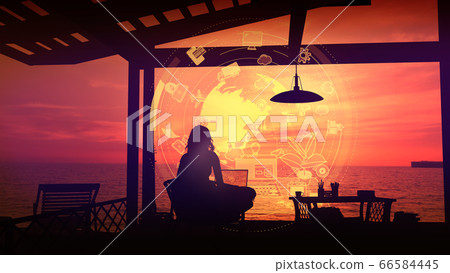 Traveler working on a laptop at sunset. Traveler working on a laptop at sunset. 66584445