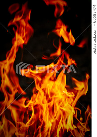 Very hot sizzling fire on black 66585474
