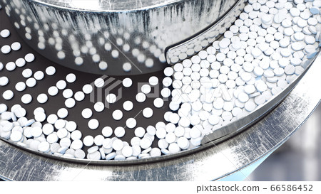 Process of production of pills, tablets. Industrial pharmaceutical concept. Factory equipment and machine. Steel. 3d rendering. Process of production of pills, tablets. Industrial pharmaceutical concept. Factory equipment and machine. Steel. 3d rendering. 66586452