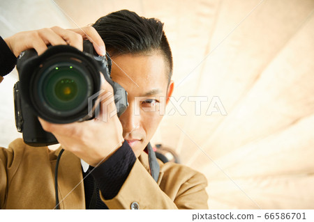 Young photographer with camera Young photographer with camera 66586701