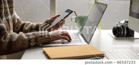 Female university student looking information on Female university student looking information on 66587235