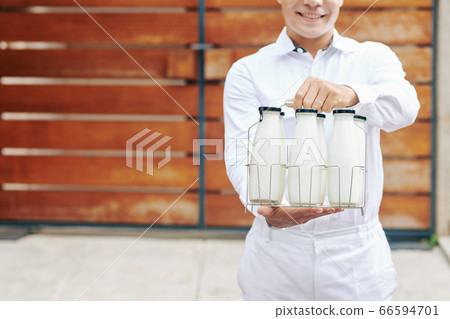 Modern Milkman Offering Milk 66594701