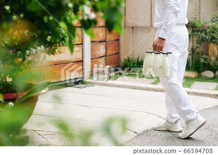 Milk Delivery Man At Work Milk Delivery Man At Work 66594708