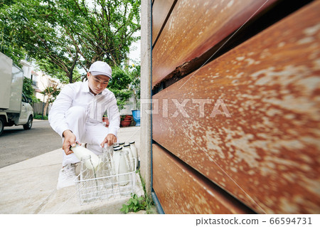 Young Milkman At Work 66594731