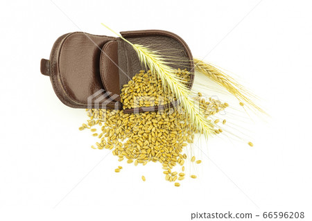 Open leather purse with wheat seeds 66596208