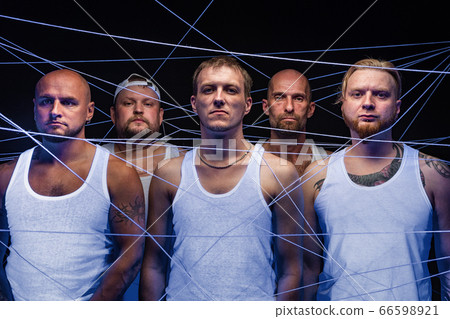 Photo of group of men tangled in white threads in ultraviolet Photo of group of men tangled in white threads in ultraviolet 66598921