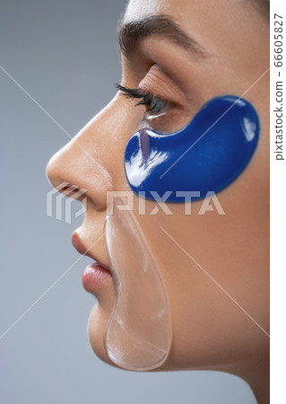 Female using anti age masks on face Female using anti age masks on face 66605827