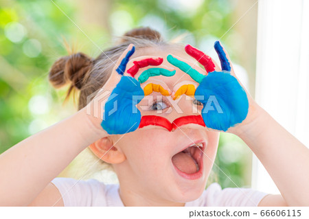 Little Girl featuring painted hands Concept Education, School, Creativity Favorite Focus. 66606115