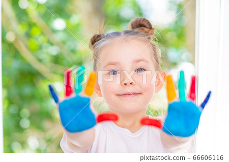 Little Girl featuring painted hands Concept Education, School, Creativity Favorite Focus. 66606116