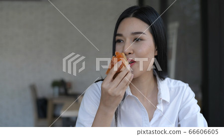 Holiday concept. Young women eating delicious 66606605