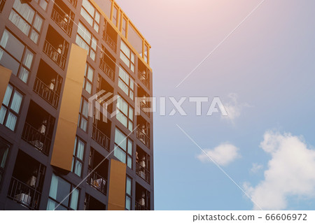 clouds in blue sky between modern buildings clouds in blue sky between modern buildings 66606972