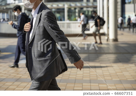 Office worker who wears a mask and goes to work 66607351