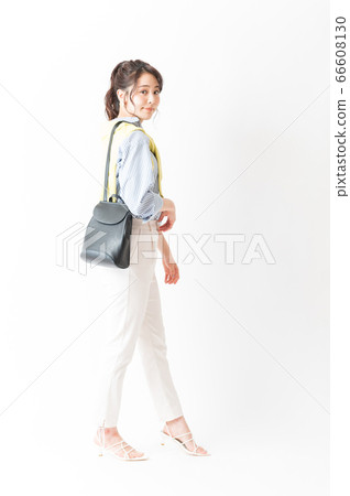 Office casual woman with shoulder bag 66608130