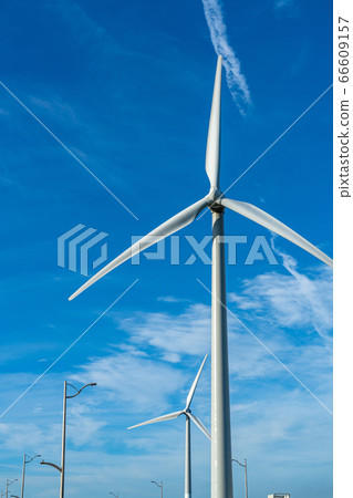 Wind turbines, blue sky and white clouds close-up 66609157