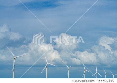 Wind turbines, blue sky and white clouds close-up Wind turbines, blue sky and white clouds close-up 66609159
