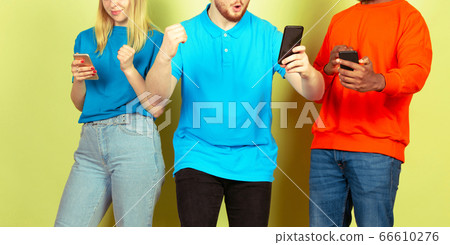 Group of friends using mobile smartphones. Teenagers addiction to new technology trends. Close up. 66610276