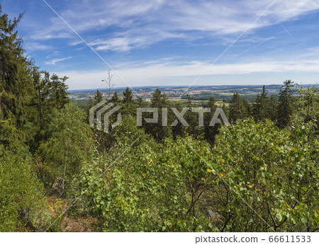 Panoramic view from look out in Brdy mountain hills, with green trees, rocks town and blue sky, Czech Republic 66611533