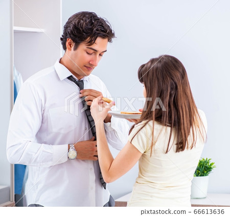 Woman sees her husband off to work 66613636