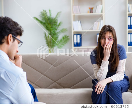 Psychologist counselling woman beaten by husband 66613755