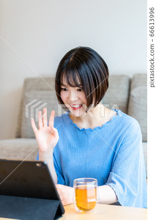 Remote work using a tablet at home 66613996