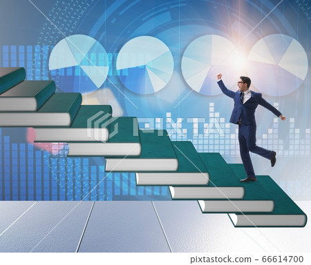 Businessman student climbing the ladder of education books 66614700